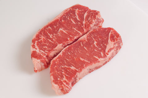 **Boneless Beef New York Strip Steaks Fireman's Cut  $12.99lb